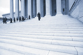 image of people on the steps of a courthouse building